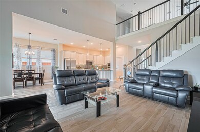Expansive living room with soaring ceilings, large