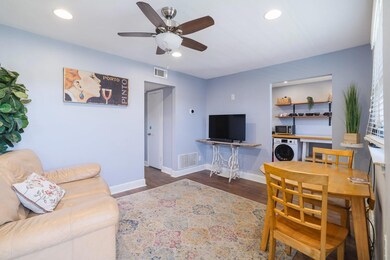 Living room featuring baseboards, visible vents, 
