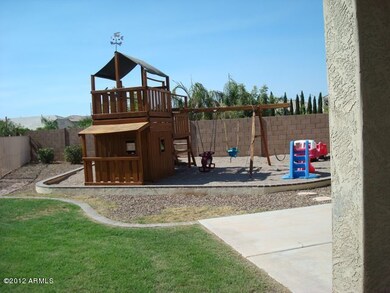 Playset and sandpit in backyard