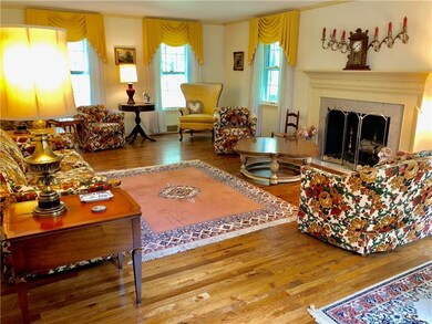 Expansive living room features a  marble-faced fir
