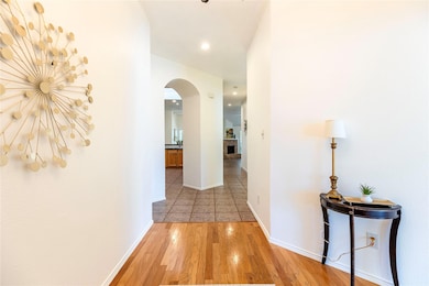 Hall with light hardwood / wood-style flooring