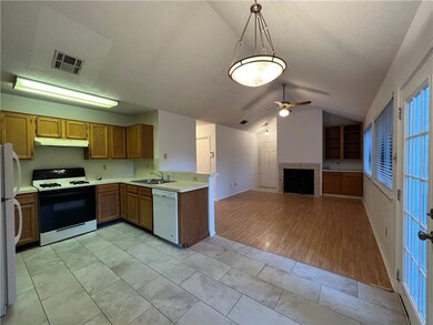 Kitchen featuring white appliances, under cabinet