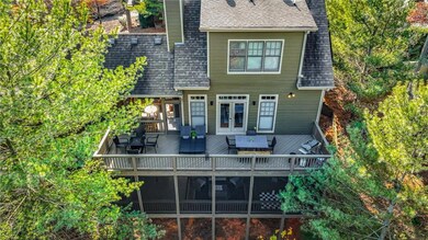 Rear view of property with french doors and a wood