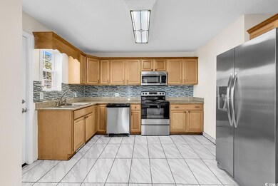 Kitchen featuring stainless steel appliances, deco