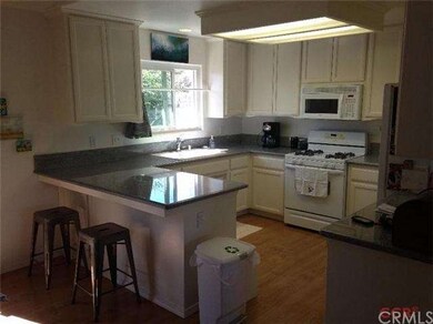 Breakfast bar and kitchen with an abundance of nat