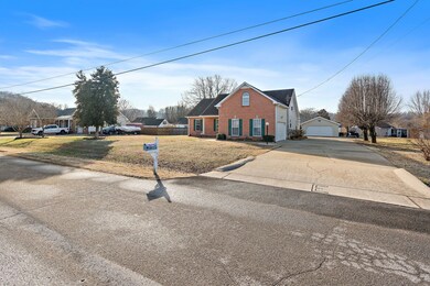 The driveway is 20 feet wide with an attached and detached garage.