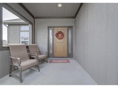 Lighted entry covered porch.