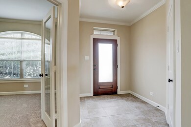 Upon entry, the light filled study is immediately to the right with French doors. Carpeting in entry, family room and stairs recently replaced.