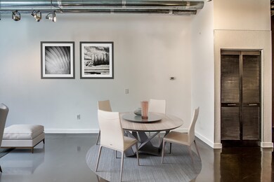 Crisp white walls for your art collection. A Walker Gallery art hanging system is already installed in this condo - just bring your art! Virtual staging of the dining area.