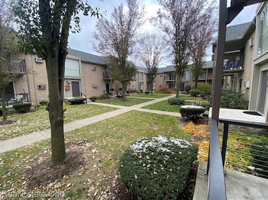 View of community featuring a lawn and a residential view