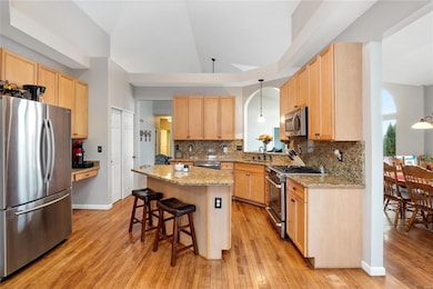 The kitchen offers granite countertops and backspl