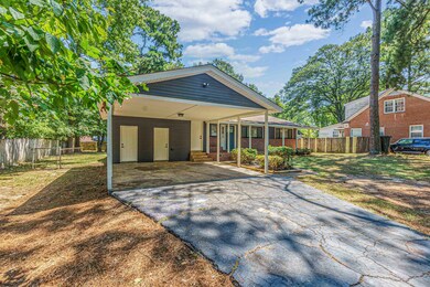 Rear view of house with a carport