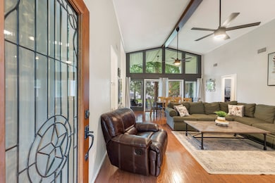 The front entrance features expansive windows that