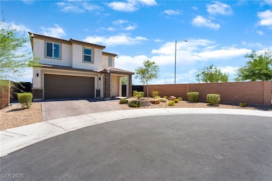 View of front of home featuring stucco siding, dri