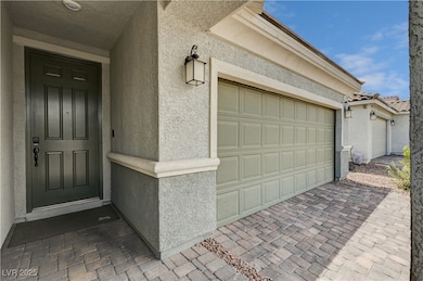 Garage featuring driveway