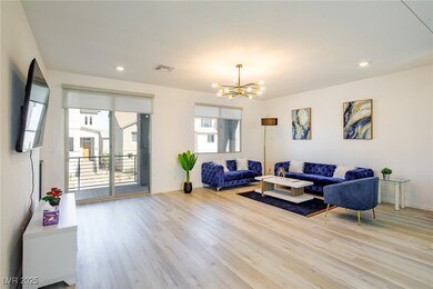 Living room with a chandelier, wood finished floor