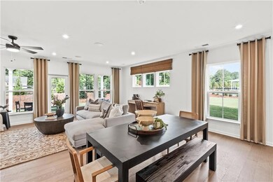 Dining space with light wood-type flooring, recessed lighting, healthy amount of natural light, and ceiling fan