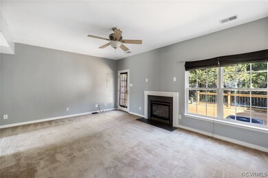 Large family room leading to the deck.  Gas firepl