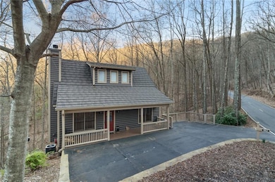 View of front of house with covered porch and a ch