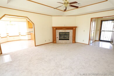 Living area has brand new carpet, fireplace with g