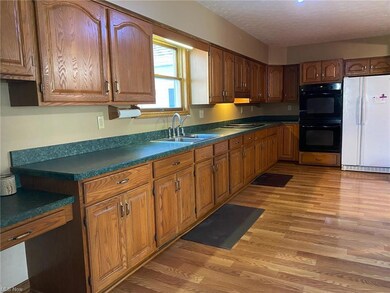 large kitchen with plenty of cabinetry and counter