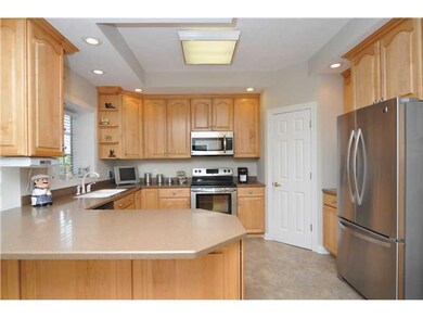 Kitchen. Oak cabinets, Corian counter tops, huge p