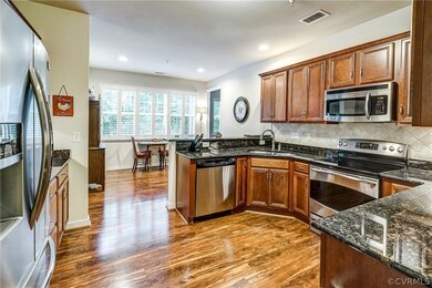Kitchen is eat in with ss appliances, granite coun