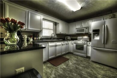 This beautiful renovated kitchen has granite, new floors, new cabinets, new paint, large walk in pantry