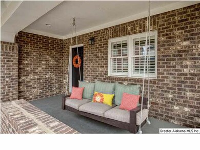 Large front porch w/ Porch swing to enjoy a summer