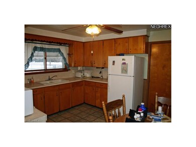 Eat in kitchen with ceramic tile flooring. Applian