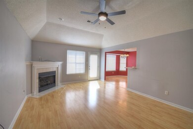 Fireplace open to kitchen and dining