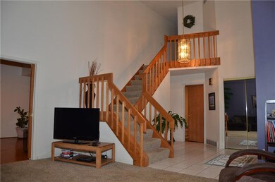 Open foyer / staircase / pocket doors to family ro