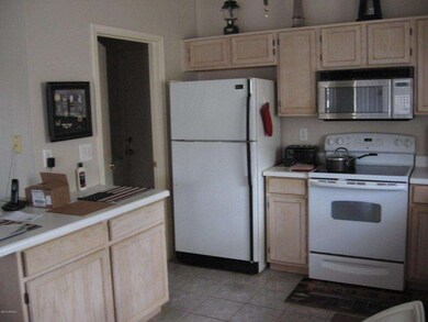 Kitchen with small breakfast bar.