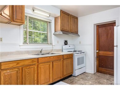 GALLEY KITCHEN WITH NEWER FLOOR AND REFRIGERATOR C