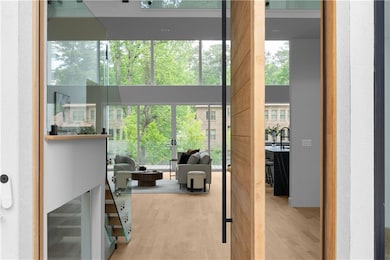 Entryway with a towering ceiling and wood finished
