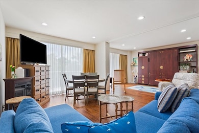 Living area with hidden retractable wall providing