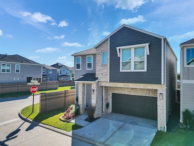 Front exterior with manicured lawn and double driveway