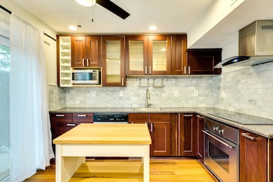 Kitchen featuring light wood-style flooring, appl