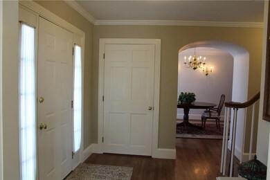 This foyer is inviting, with...
