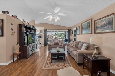 The living room has views of the back porch and ga