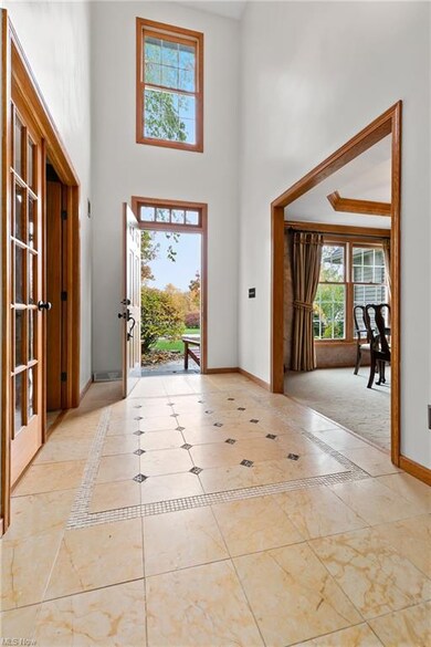 Large foyer with detailed ceramic tilework