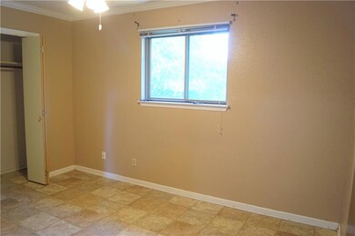 Unfurnished bedroom with ornamental molding and a