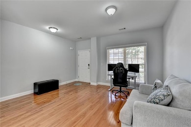 Dining area featuring light wood finished floors, ornamental molding, ceiling fan, and baseboards