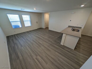 Unfurnished living room with dark wood-type floori