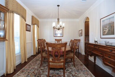 To the other side of the  entry, is the formal dining, with a butlers pantry for convenient entertaining.