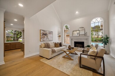 WITH VIEWS TO THE BACKYARD, THE FAMILY ROOM IS AN