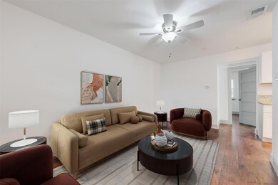 Living room with light wood-type flooring and ceil