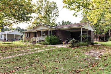 Single story home featuring a front yard