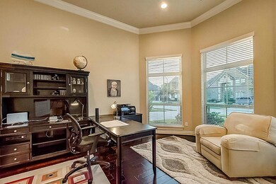 two-story ceilings in the study. Windows lookout onto the front yard.