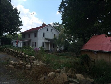 Side view of home and tool shed.